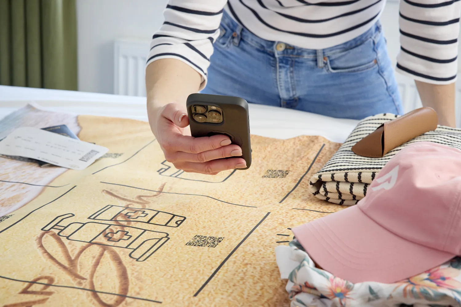 Close view of a phone scanning a QR code on the map
